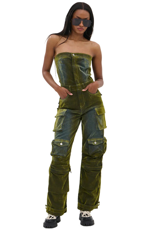 Woman wearing a strapless green jumpsuit with cargo pockets on a white background